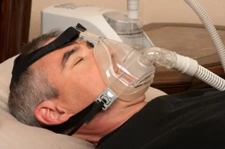 man wearing cpap device