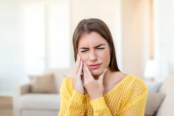 woman with jaw pain from tmj